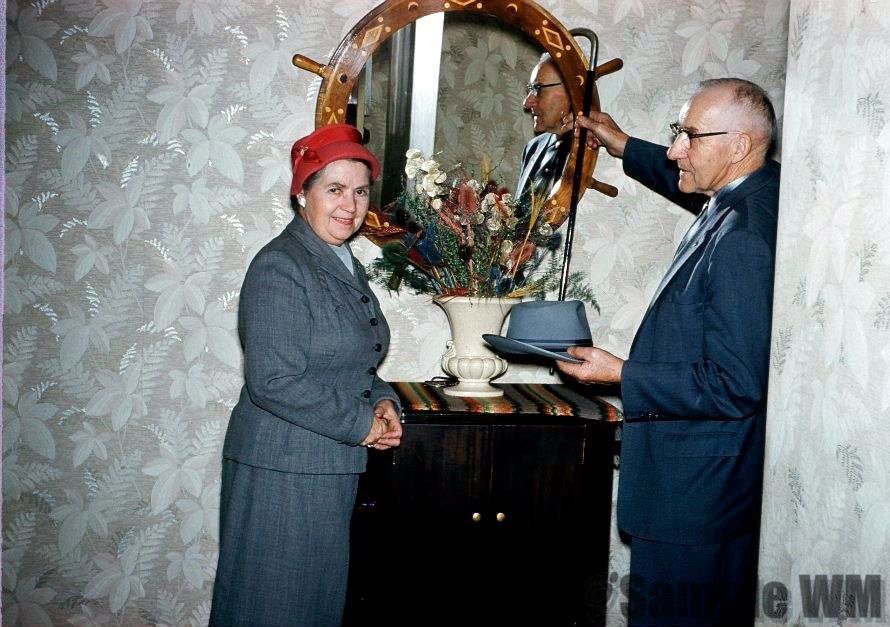 John and Kristine  Landro in front of one of his myrtlewood mirrors
